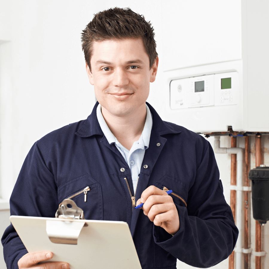 Plumber repairing leaking pipework under a sink in a Glasgow home